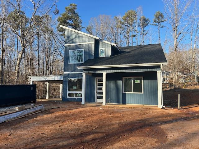 view of front of home featuring a carport