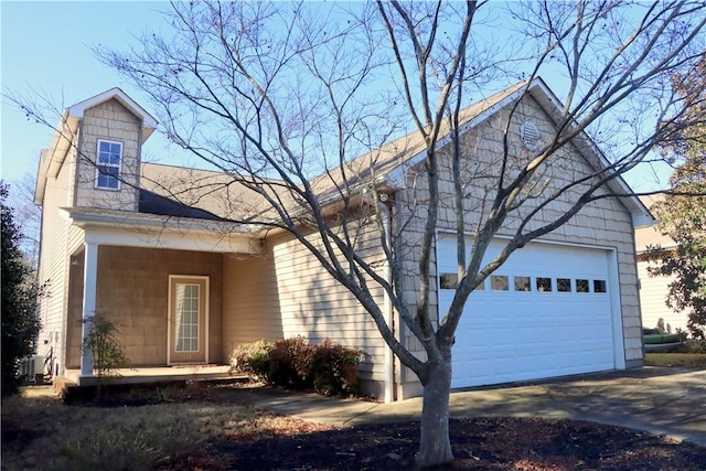 view of front of house featuring a garage and covered porch