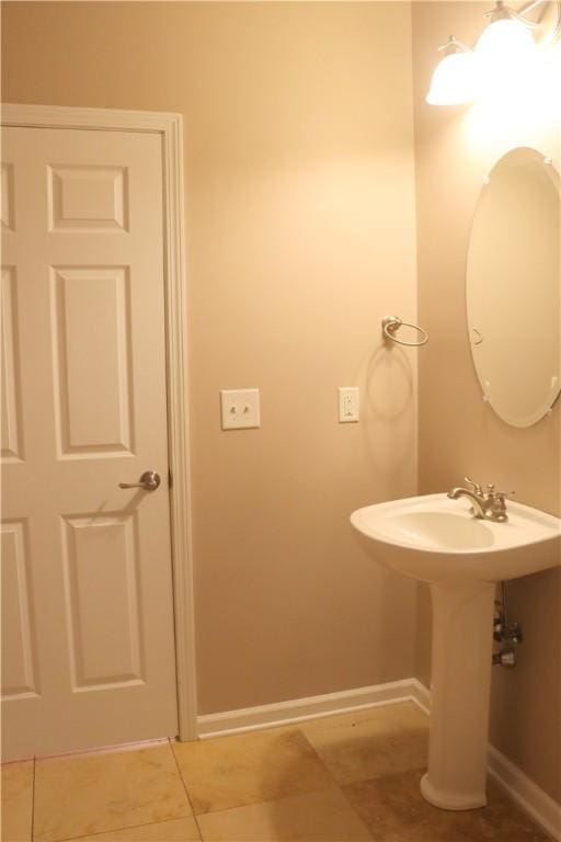 bathroom featuring tile patterned flooring and sink