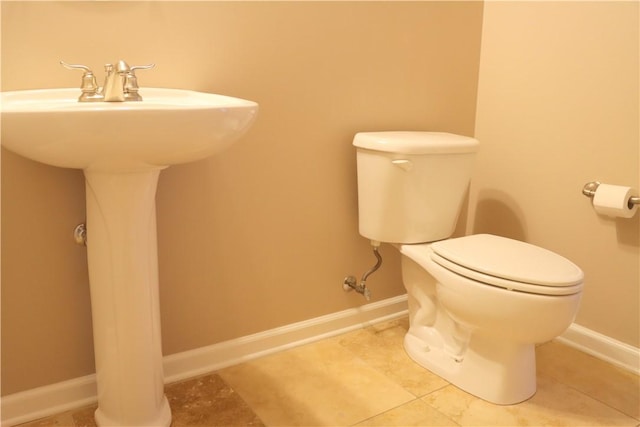 bathroom with tile patterned floors and toilet