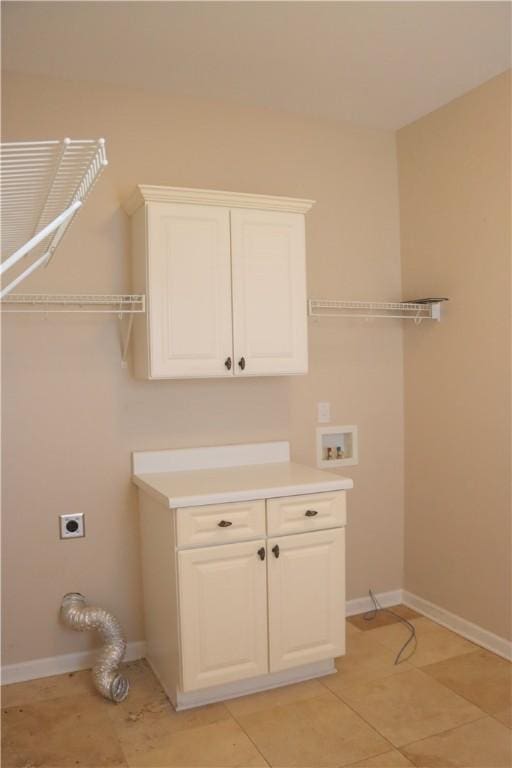 laundry area with washer hookup, light tile patterned floors, cabinets, and hookup for an electric dryer