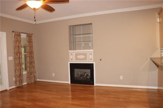 unfurnished living room featuring wood-type flooring, ceiling fan, and crown molding