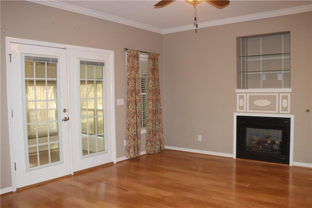 unfurnished living room with crown molding, ceiling fan, and hardwood / wood-style flooring