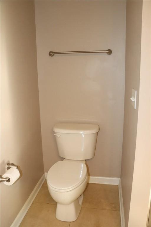 bathroom with tile patterned floors and toilet