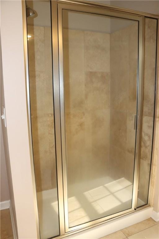 bathroom featuring tile patterned flooring and walk in shower