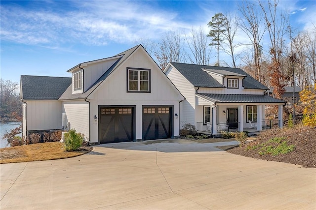 modern farmhouse style home with a porch and a garage