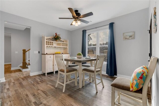 dining space featuring ceiling fan and light hardwood / wood-style flooring