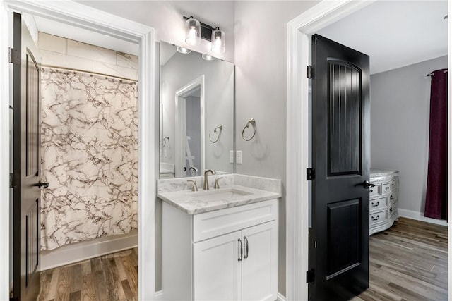 bathroom featuring vanity and hardwood / wood-style flooring