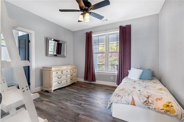 bedroom featuring ceiling fan and dark wood-type flooring