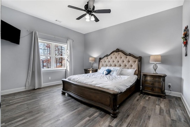 bedroom featuring ceiling fan and dark wood-type flooring