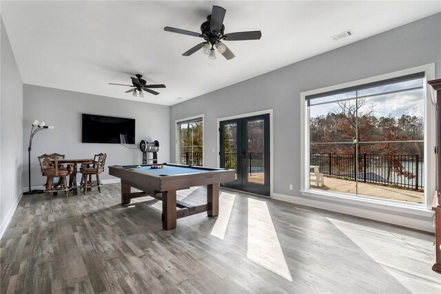 playroom with hardwood / wood-style floors, ceiling fan, billiards, and french doors