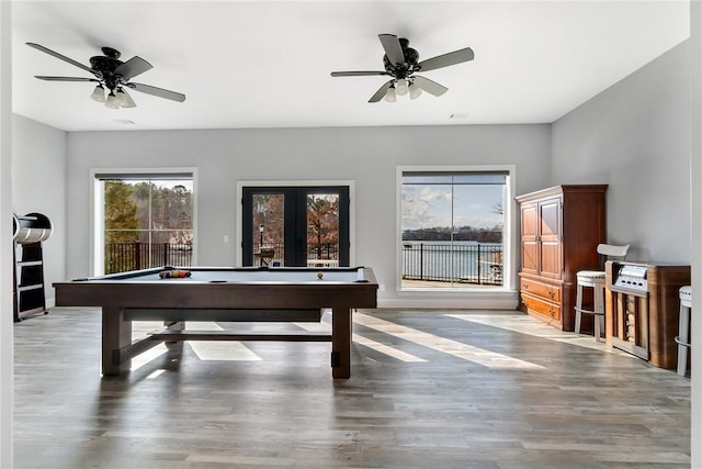 playroom with ceiling fan, wood-type flooring, pool table, and french doors