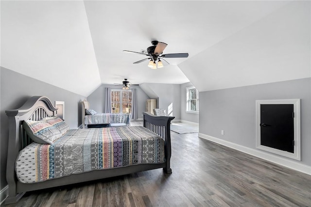 bedroom with ceiling fan, dark hardwood / wood-style flooring, and lofted ceiling