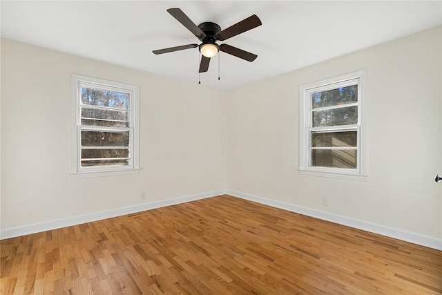 spare room featuring ceiling fan and hardwood / wood-style floors