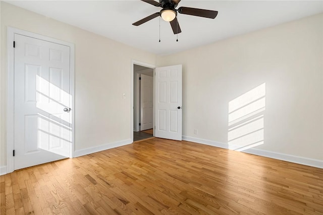 unfurnished bedroom featuring ceiling fan and wood-type flooring