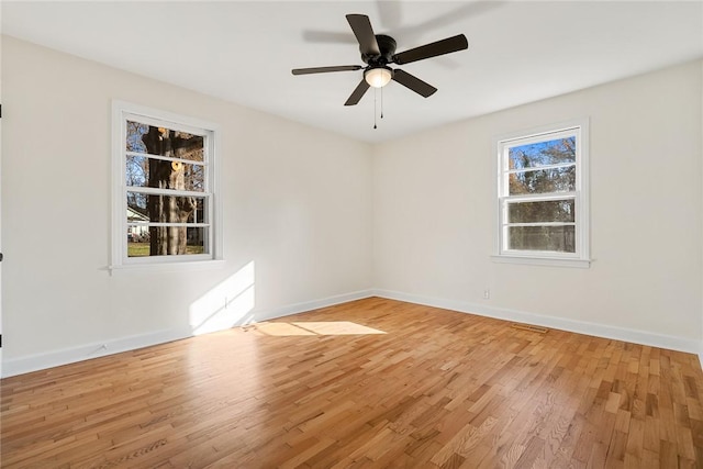 unfurnished room with light wood-type flooring and ceiling fan