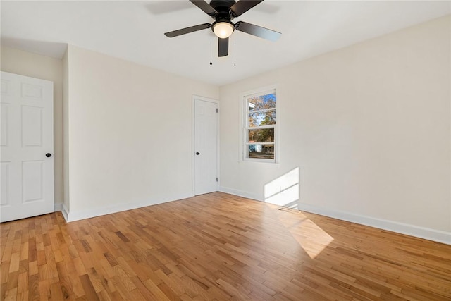 empty room featuring light hardwood / wood-style flooring and ceiling fan