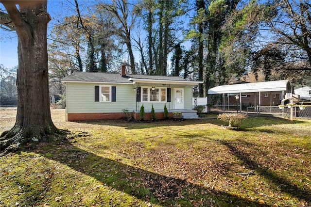 ranch-style home featuring a front yard