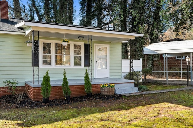 property entrance with a lawn