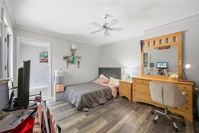 bedroom with ceiling fan, dark hardwood / wood-style floors, and crown molding