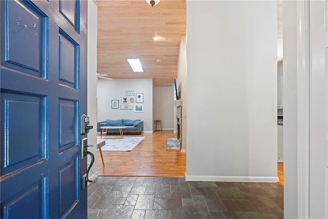 foyer with wooden ceiling and dark wood-type flooring