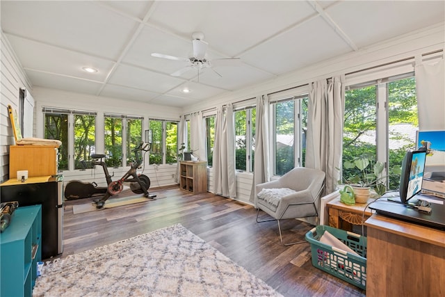 sunroom / solarium with ceiling fan and coffered ceiling