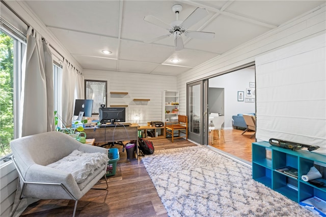 sunroom featuring ceiling fan and french doors