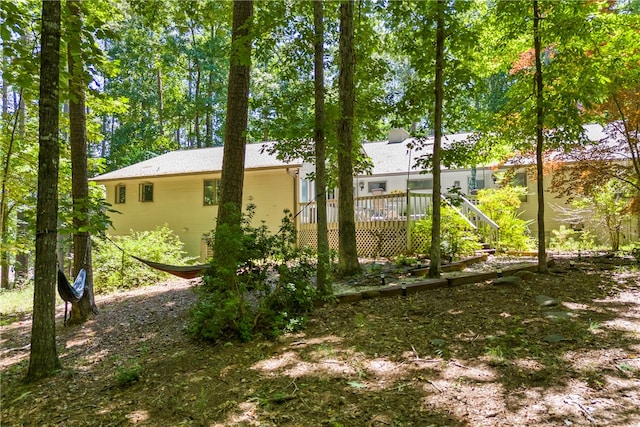 view of yard with a wooden deck