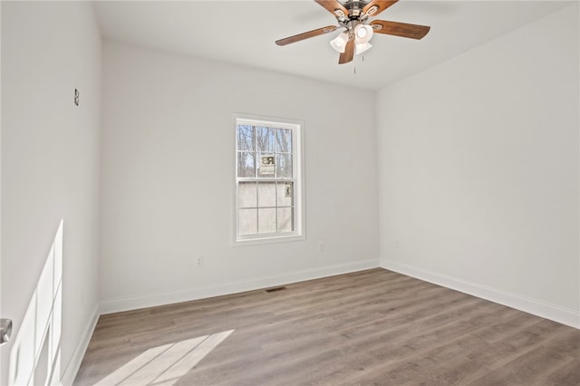 unfurnished room with ceiling fan and light hardwood / wood-style floors