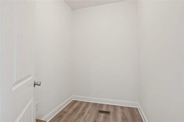 spare room with hardwood / wood-style flooring