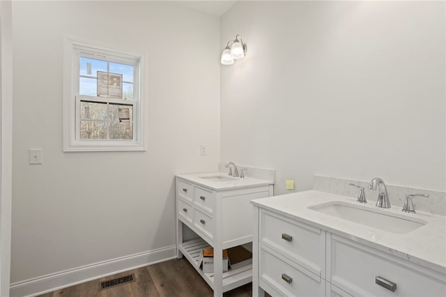 bathroom featuring vanity and wood-type flooring