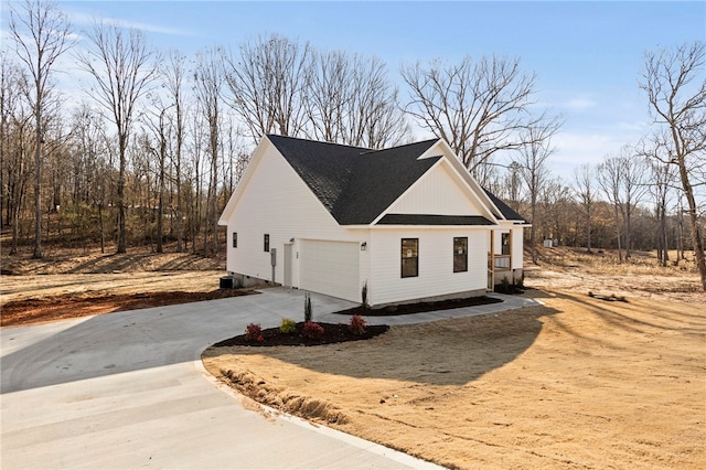 view of side of home with a garage