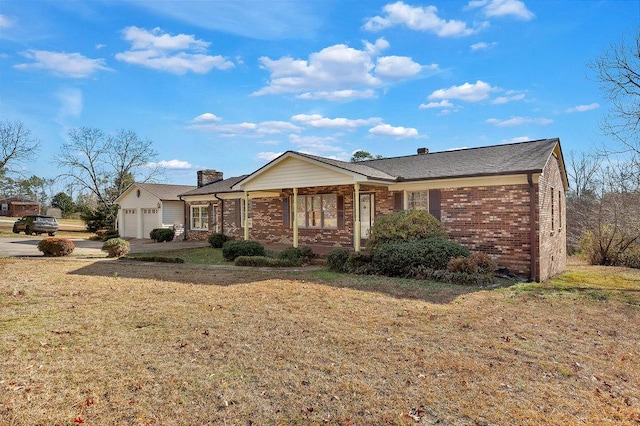 ranch-style home with a front lawn and a garage