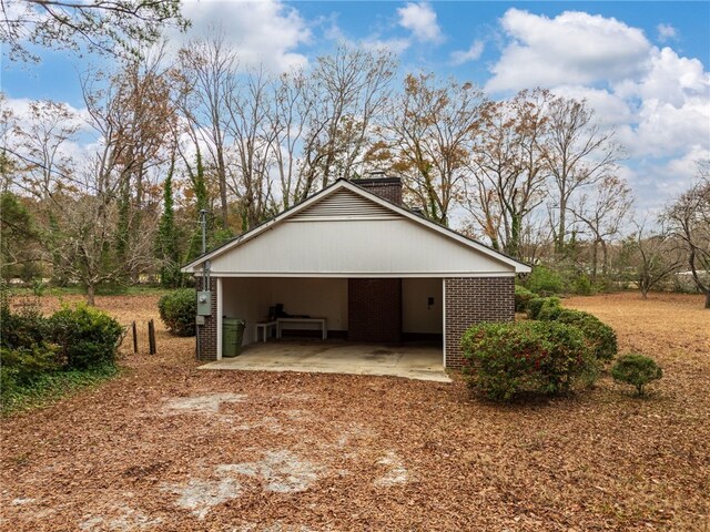 view of side of property with a carport