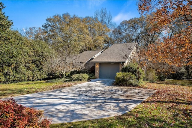 view of front of property with a front lawn and a garage