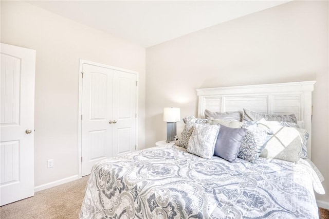 carpeted bedroom featuring a closet