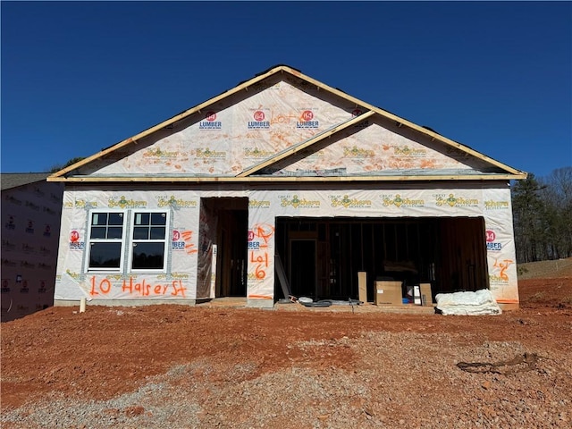 unfinished property with a garage