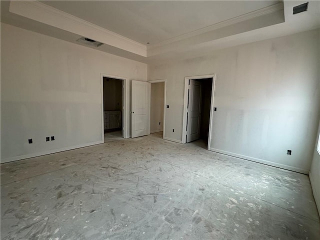 unfurnished bedroom with ensuite bathroom, a tray ceiling, baseboards, and crown molding