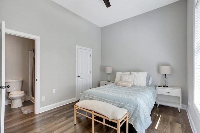 bedroom featuring connected bathroom, ceiling fan, and dark hardwood / wood-style flooring