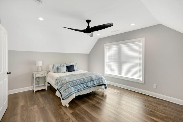 bedroom featuring ceiling fan, dark hardwood / wood-style floors, and lofted ceiling