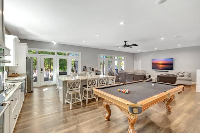 game room featuring ceiling fan, light hardwood / wood-style floors, pool table, and french doors