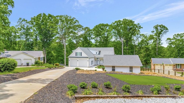 view of front of home featuring a garage and a front yard