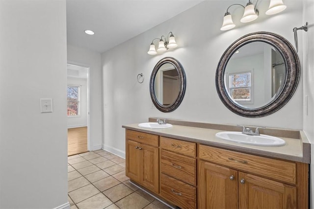 bathroom with tile patterned floors and vanity