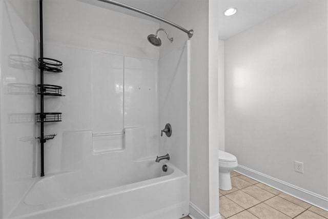 bathroom with bathtub / shower combination, tile patterned floors, and toilet