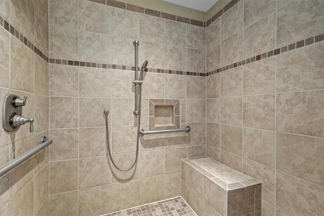 bathroom featuring a tile shower