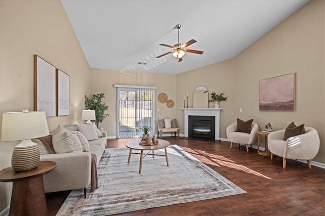 living room with ceiling fan, dark wood-type flooring, and lofted ceiling