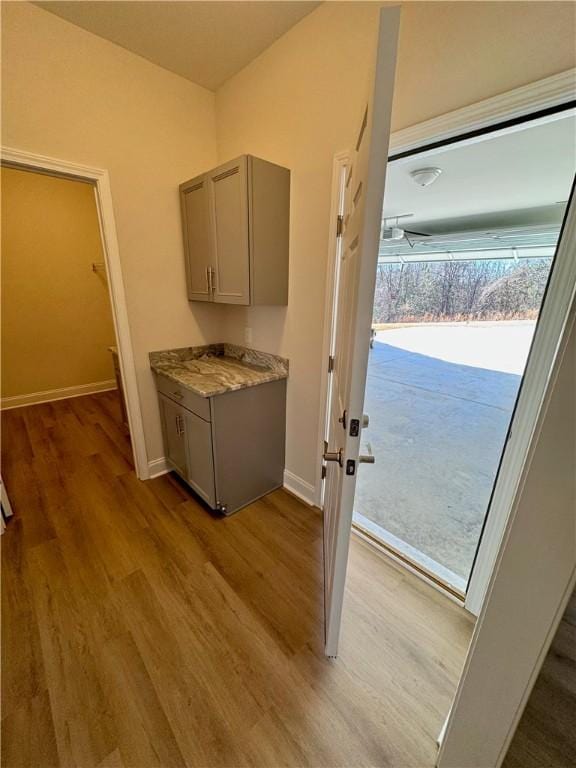 kitchen featuring gray cabinets and light wood-type flooring