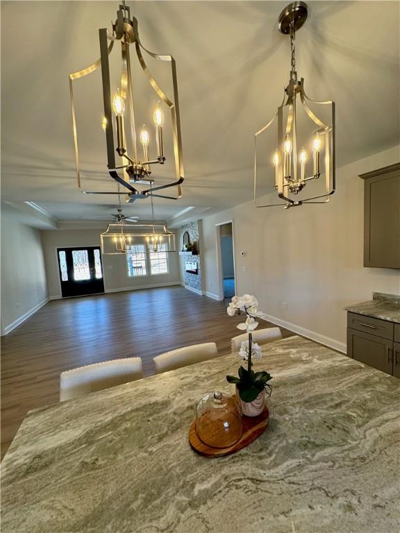 unfurnished dining area with dark hardwood / wood-style floors and french doors