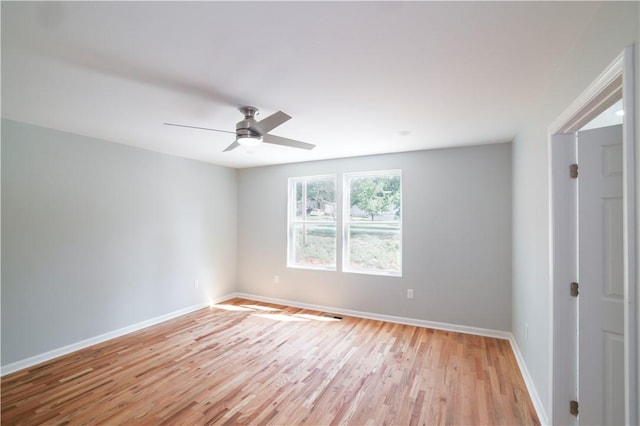 empty room featuring ceiling fan and light hardwood / wood-style floors