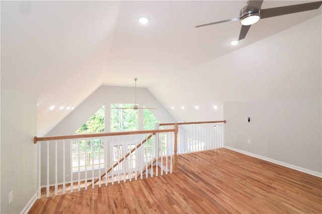 bonus room with hardwood / wood-style floors, vaulted ceiling, and ceiling fan